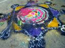 A sand mandala drawn on the floor for the puja ceremony