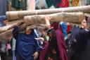 Women in so-called Islamic Cairo carrying carpets. They gave me a wink when they saw me take the picture